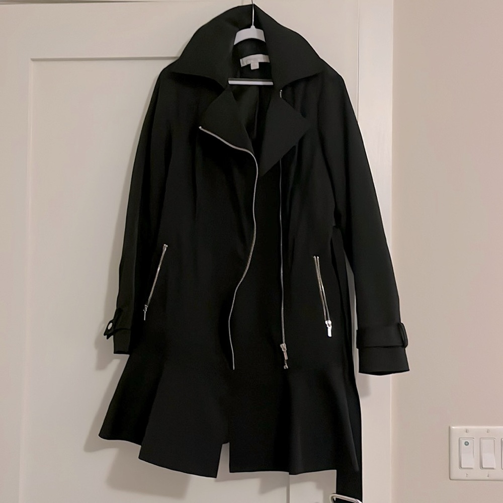 Black ruffled bottom trench coat, with zip pockets and belt